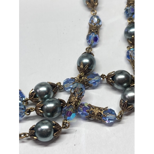 641 - A VICTORIAN STYLE THREE STRAND BLUE GLASS AND BEAD NECKLACE IN A KENDAL MILNE MANCHESTER PRESENTATIO... 