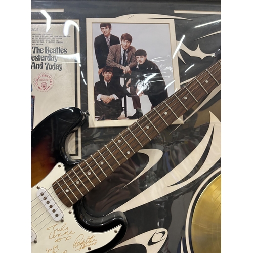 69 - A FRAMED BEATLES MONTAGE WHICH INCLUDES A 'LEGENDS' SIGNED GUITAR, GOLD DISC, PHOTOGRAPH, ALBUM COVE... 