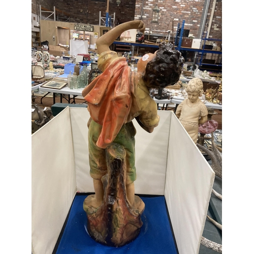 72 - A LARGE CHALK FIGURINE OF A BOY - CHERRY PICKING