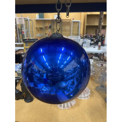 76 - A LARGE VICTORIAN MIRRORED BLUE GLASS WITCHES BALL ON A CHAIN, CIRCUMFERENCE APPROX 51CM