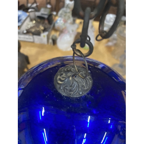 76 - A LARGE VICTORIAN MIRRORED BLUE GLASS WITCHES BALL ON A CHAIN, CIRCUMFERENCE APPROX 51CM