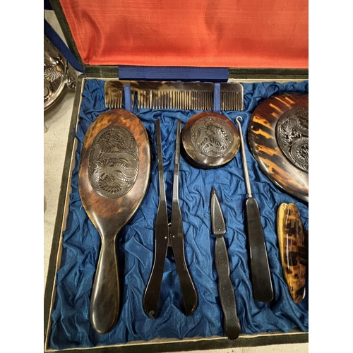 9 - A VINTAGE TWELVE PIECE CARVED TORTOISESHELL DRESSING TABLE SET IN A VELEVET CASE