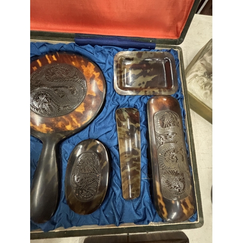 9 - A VINTAGE TWELVE PIECE CARVED TORTOISESHELL DRESSING TABLE SET IN A VELEVET CASE