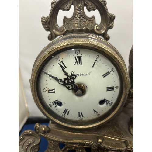 92 - A DECORATIVE GILT BRONZE 20TH CENTURY GERMAN MANTLE CLOCK WITH WHITE ENAMEL DIAL MARKED IMPERIAL AND... 