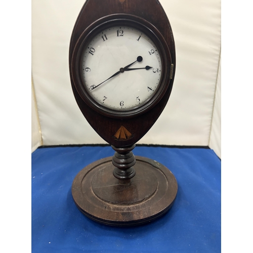 93 - AN INLAID MAHOGANY MANTLE CLOCK WITH WHITE ENAMEL DIAL AND BRASS FINIAL