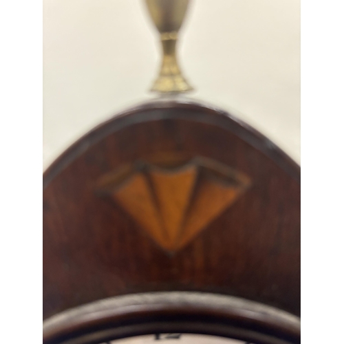 93 - AN INLAID MAHOGANY MANTLE CLOCK WITH WHITE ENAMEL DIAL AND BRASS FINIAL