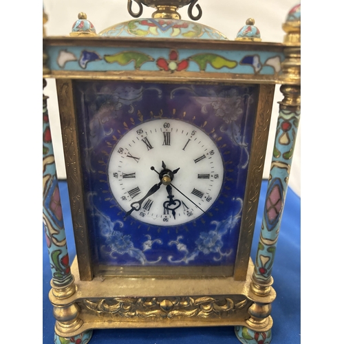 94 - A DECORATIVE CLOISONNE MECHANICAL MANTEL CLOCK