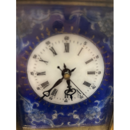 94 - A DECORATIVE CLOISONNE MECHANICAL MANTEL CLOCK