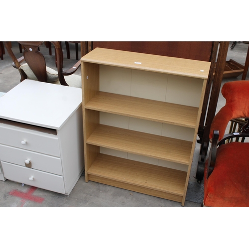 2956 - TWO WHITE BEDROOM CHESTS AND AN OPEN THREE TIER BOOKCASE