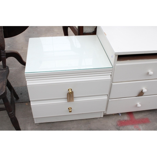 2956 - TWO WHITE BEDROOM CHESTS AND AN OPEN THREE TIER BOOKCASE