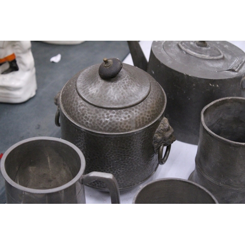 142 - A QUANTITY OF PEWTER TO INCLUDE A HAMMERED BISCUIT BARREL, TANKARDS, TEAPOTS, ETC.,