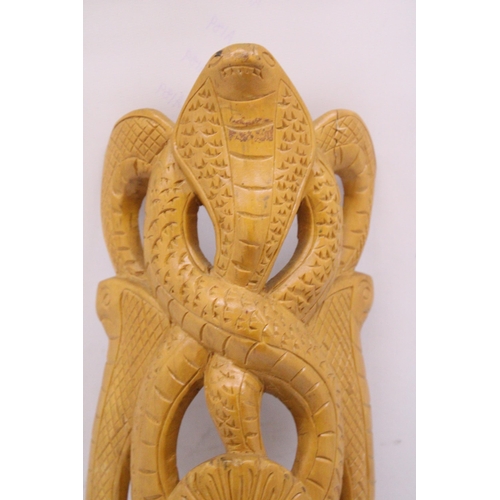 148 - A HAND CARVED WOODEN SNAKE MASK