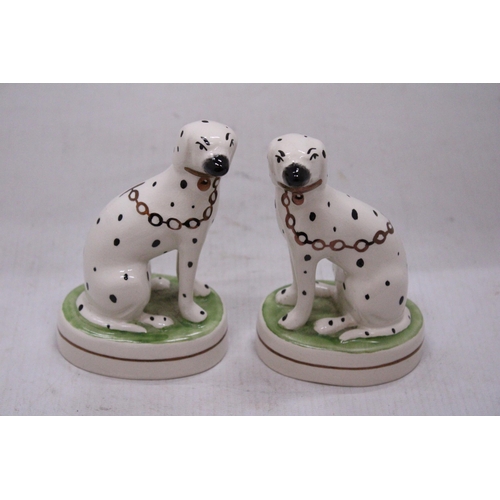 154 - A PAIR OF STAFFORDSHIRE WARE DALMATIAN FIGURES