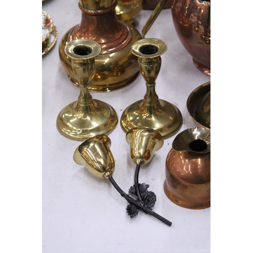 187 - A QUANTITY OF BRASS AND COPPERWARE TO INCLUDE LARGE CANDLESTICKS, STOVE KETTLE, PLANTER, ETC.,