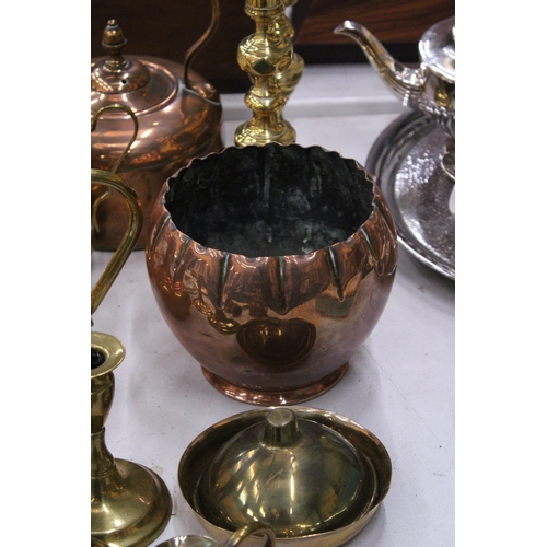 187 - A QUANTITY OF BRASS AND COPPERWARE TO INCLUDE LARGE CANDLESTICKS, STOVE KETTLE, PLANTER, ETC.,