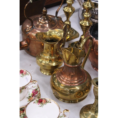 187 - A QUANTITY OF BRASS AND COPPERWARE TO INCLUDE LARGE CANDLESTICKS, STOVE KETTLE, PLANTER, ETC.,