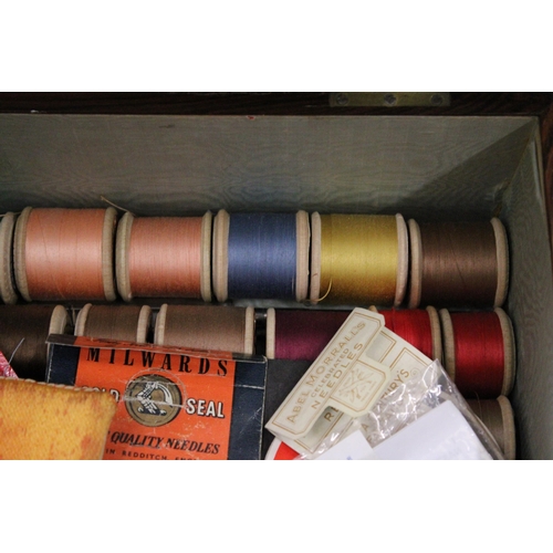 196 - A VINTAGE SEWING BOX AND CONTENTS