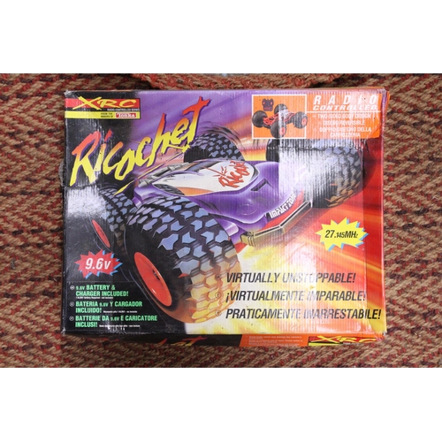 353 - AN XRC, RICOCHET, RADIO CONTROLLED DUNE BUGGY - BOXED