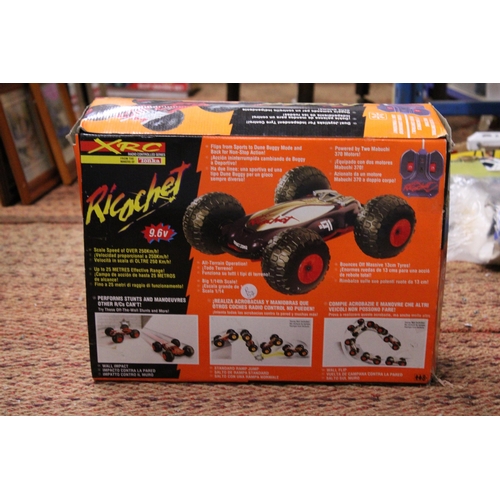 353 - AN XRC, RICOCHET, RADIO CONTROLLED DUNE BUGGY - BOXED