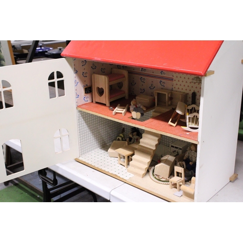 591A - A WOODEN DOLLS HOUSE WITH A QUANTITY OF FURNITURE AND FIGURES