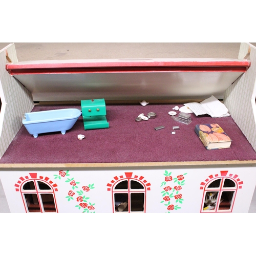 591A - A WOODEN DOLLS HOUSE WITH A QUANTITY OF FURNITURE AND FIGURES