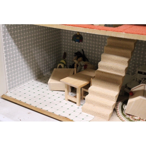 591A - A WOODEN DOLLS HOUSE WITH A QUANTITY OF FURNITURE AND FIGURES