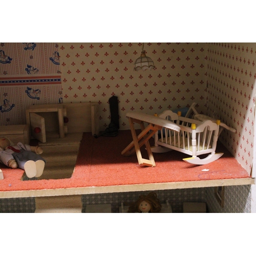 591A - A WOODEN DOLLS HOUSE WITH A QUANTITY OF FURNITURE AND FIGURES