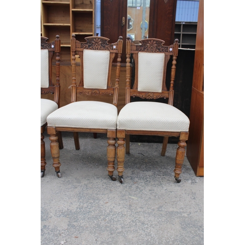 2817 - A SET OF SIX VICTORIAN CARVED OAK DINING CHAIRS WITH UPHOLSTERED SEATS AND BACKS