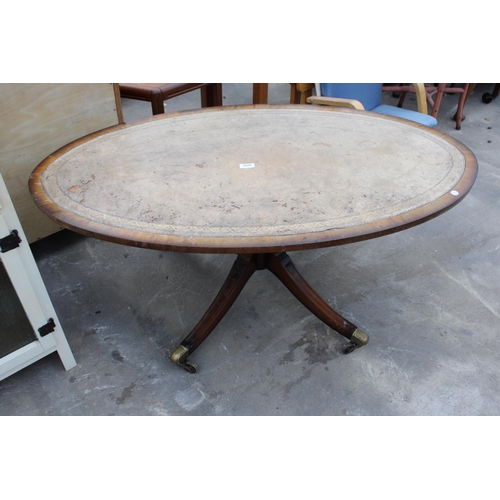 2824 - AN OVAL MAHOGANY COFFEE TABLE WITH INSET LEATHER TOP ON PEDESTAL BASE, 48