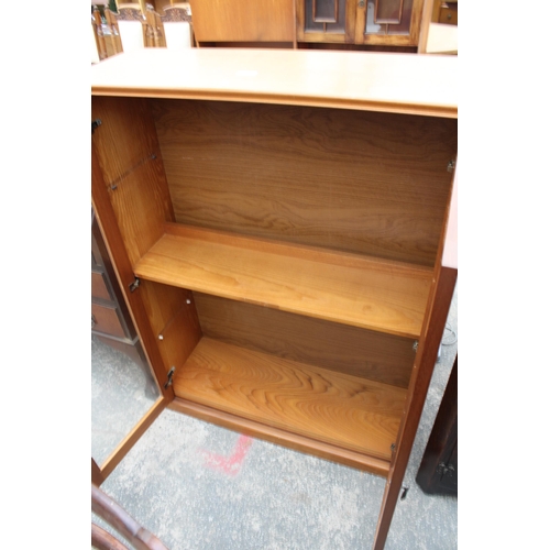 2944 - A TEAK TWO DOOR GLAZED BOOKCASE BEARING GEO.E. BRYANT AND SONS LTD LABEL, 35