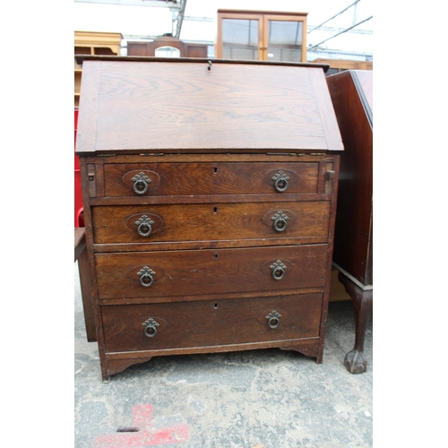 2946 - AN EARLY 20TH CENTURY OAK BUREAU WITH FOUR DRAWERS TO BASE, 32