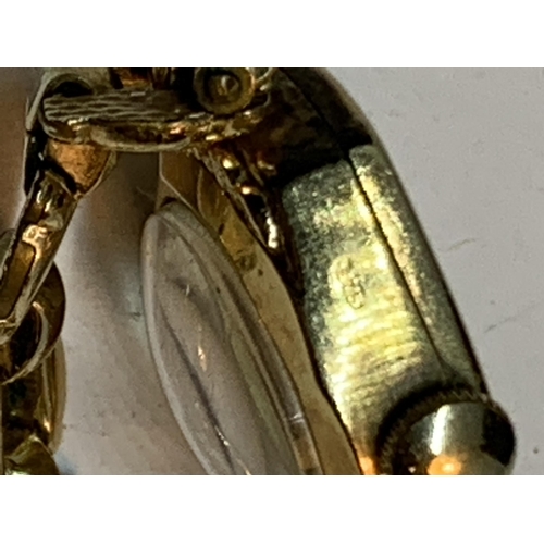 690 - A ROTARY LADIES WRIST WATCH WITH MARKED 9 CARAT GOLD CASE AND GOLD PLATED STRAP