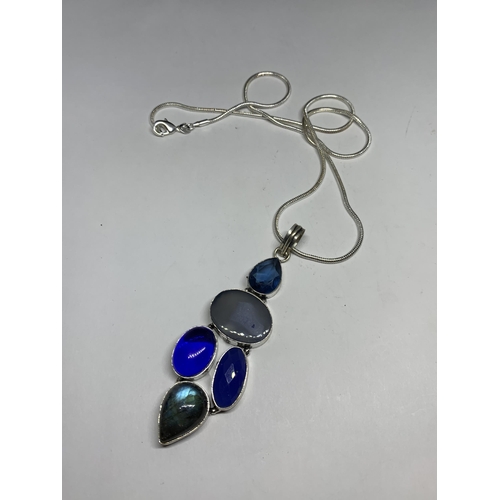 694 - A MARKED SILVER NECKLACE AND PENDANT WITH BLUE STONES IN A PRESENTATION BOX