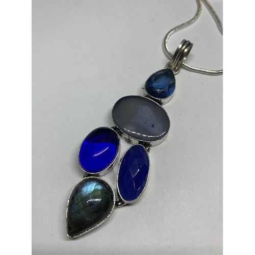 694 - A MARKED SILVER NECKLACE AND PENDANT WITH BLUE STONES IN A PRESENTATION BOX