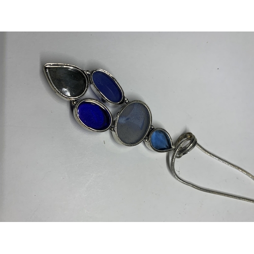 694 - A MARKED SILVER NECKLACE AND PENDANT WITH BLUE STONES IN A PRESENTATION BOX