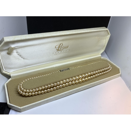 718 - A DOUBLE STRING OF LOTUS PEARLS IN A PRESENTATION BOX