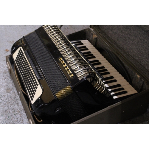 217 - A VINTAGE HOHNER ATLANTIC PIANO ACCORDIAN IN A CASE