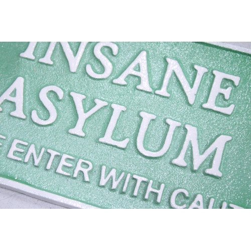 249 - A CAST 'INSANE ASYLUM' SIGN, 26CM X 15CM