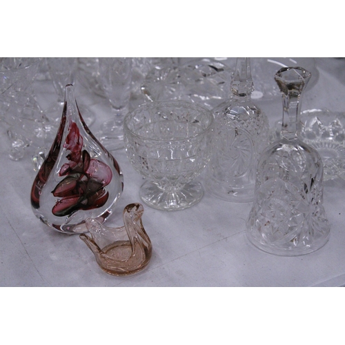 267 - A QUANTITY OF GLASSWARE TO INCLUDE DECANTERS, VASES, BOWLS, BELLS, A PAPERWEIGHT, ETC