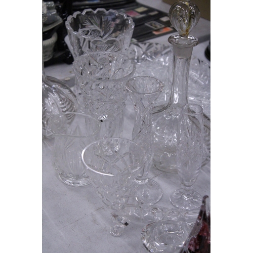 267 - A QUANTITY OF GLASSWARE TO INCLUDE DECANTERS, VASES, BOWLS, BELLS, A PAPERWEIGHT, ETC