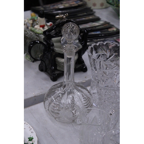 267 - A QUANTITY OF GLASSWARE TO INCLUDE DECANTERS, VASES, BOWLS, BELLS, A PAPERWEIGHT, ETC