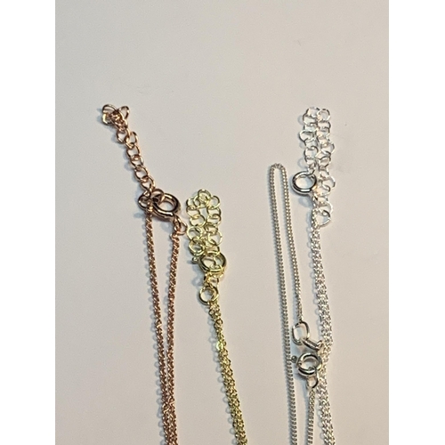 582 - FOUR MARKED SILVER NECKLACES TO INCLUDE A ROSE GOLD AND A YELLOW GOLD PLATED