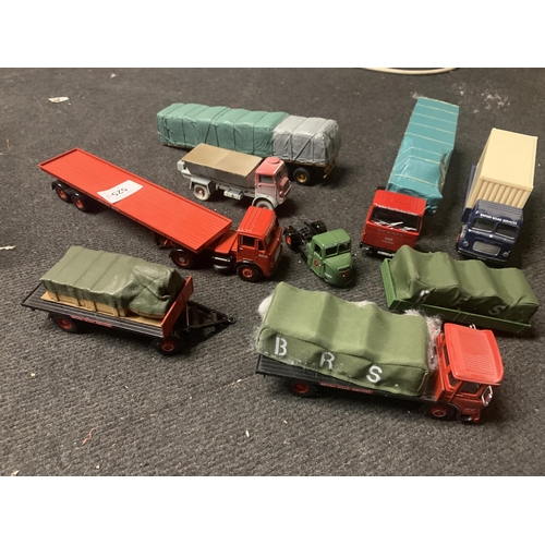 525 - FOUR CORGI, BRITISH ROAD SERVICES TRUCKS, A TRACTOR UNIT AND THREE TRAILERS, SOME WITH LOADS