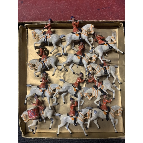 528 - A VINTAGE SET OF TWELVE BRITAINS, MOUNTED BAND OF THE FIRST LIFEGUARDS, WITH RED JACKETS