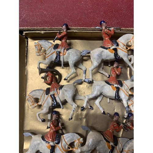 528 - A VINTAGE SET OF TWELVE BRITAINS, MOUNTED BAND OF THE FIRST LIFEGUARDS, WITH RED JACKETS