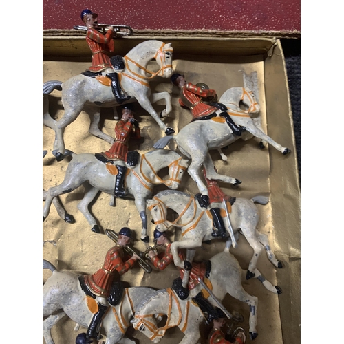 528 - A VINTAGE SET OF TWELVE BRITAINS, MOUNTED BAND OF THE FIRST LIFEGUARDS, WITH RED JACKETS