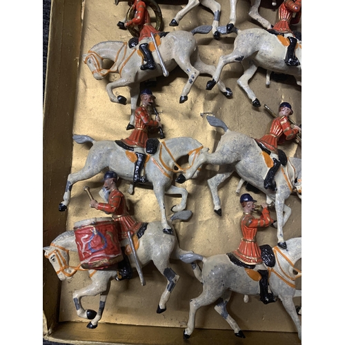 528 - A VINTAGE SET OF TWELVE BRITAINS, MOUNTED BAND OF THE FIRST LIFEGUARDS, WITH RED JACKETS