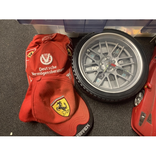 537 - A QUANTITY OF CARS, ETC TO INCLUDE FERRARI, TWO FERRARI CAPS AND A WHEEL SHAPED WALL CLOCK