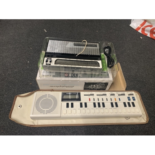 544 - A BOXED STYLOPHONE AND A CASIO ELECTRONIC MUSICAL INSTRUMENT