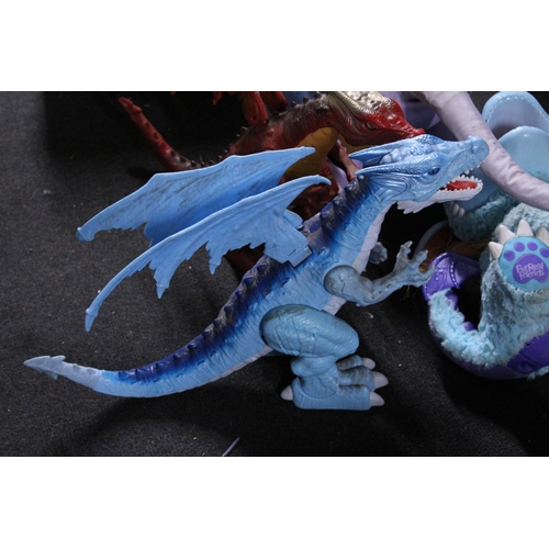 581 - FOUR LARGE TOY FIGURES TO INCLUDE TWO DRAGONS